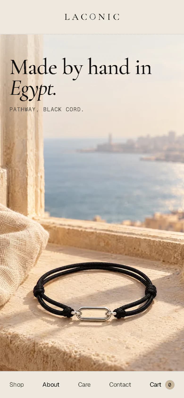 The same section on a phone: "Made by hand in Egypt." above a tall picture of the bracelet on a window ledge over the sea.