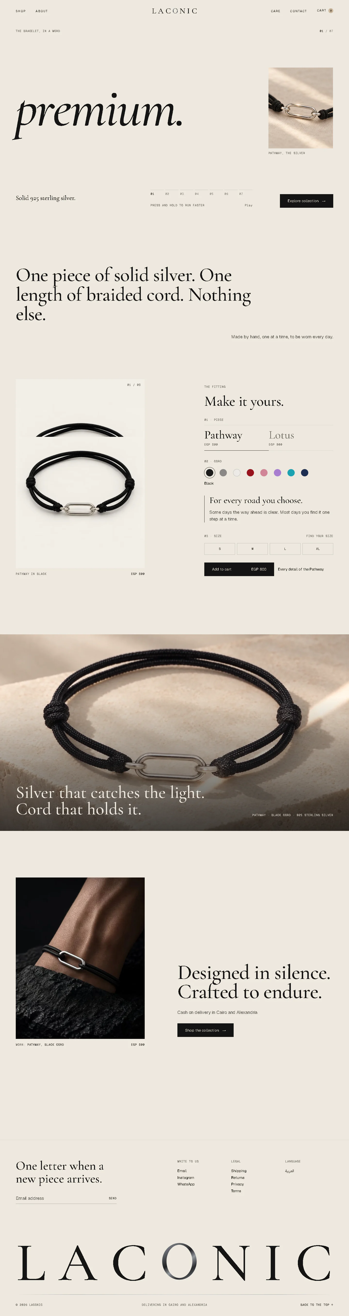 The whole LACONIC home page on a laptop: the word premium. with its picture, the line about one piece of silver and one length of cord, the fitting, the full-width silver picture, the bracelet worn, the newsletter and the giant LACONIC wordmark in the footer.