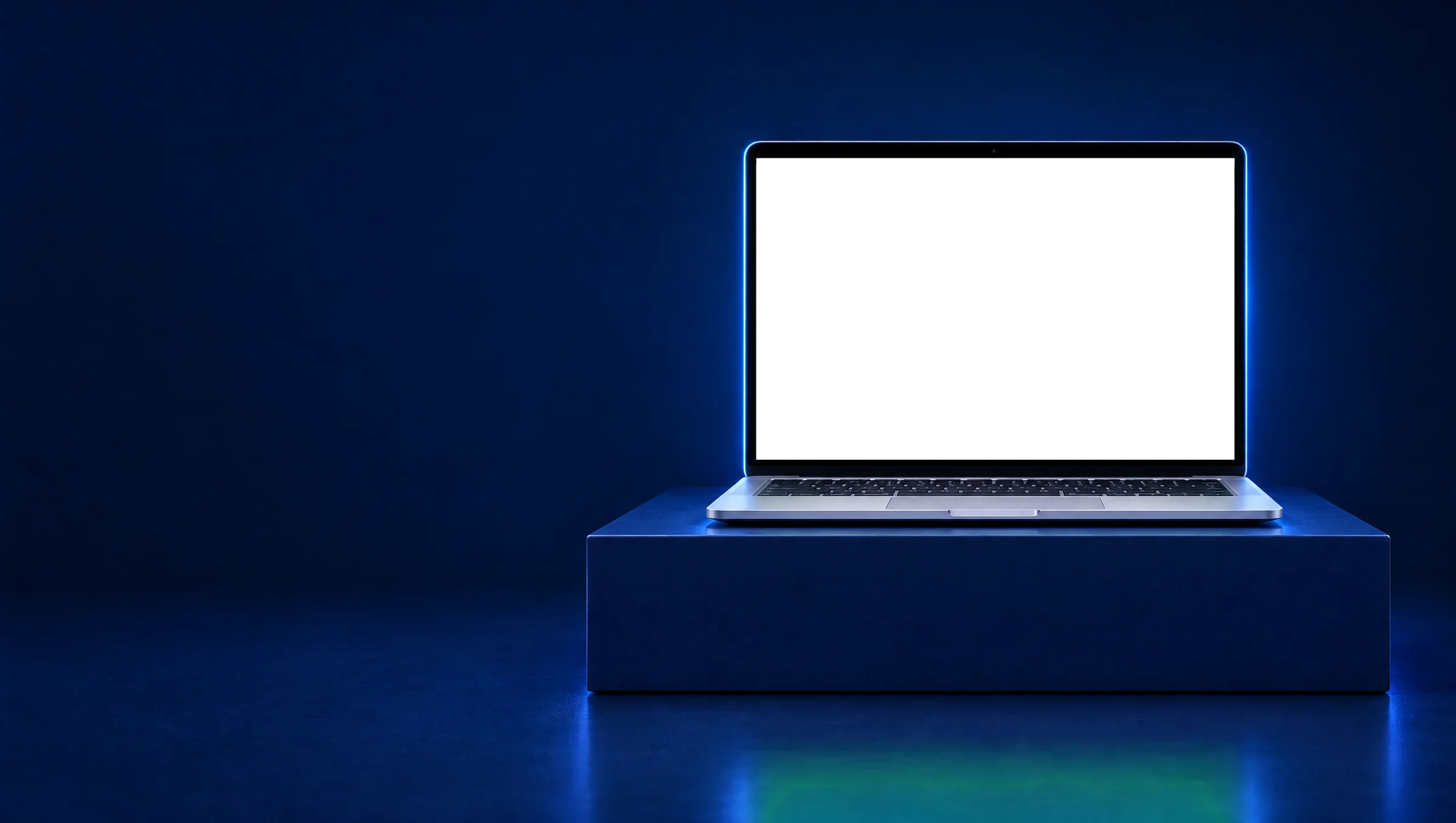 A laptop on a navy plinth showing the Atelier Rawda homepage, old and rebuilt, split by a divider
